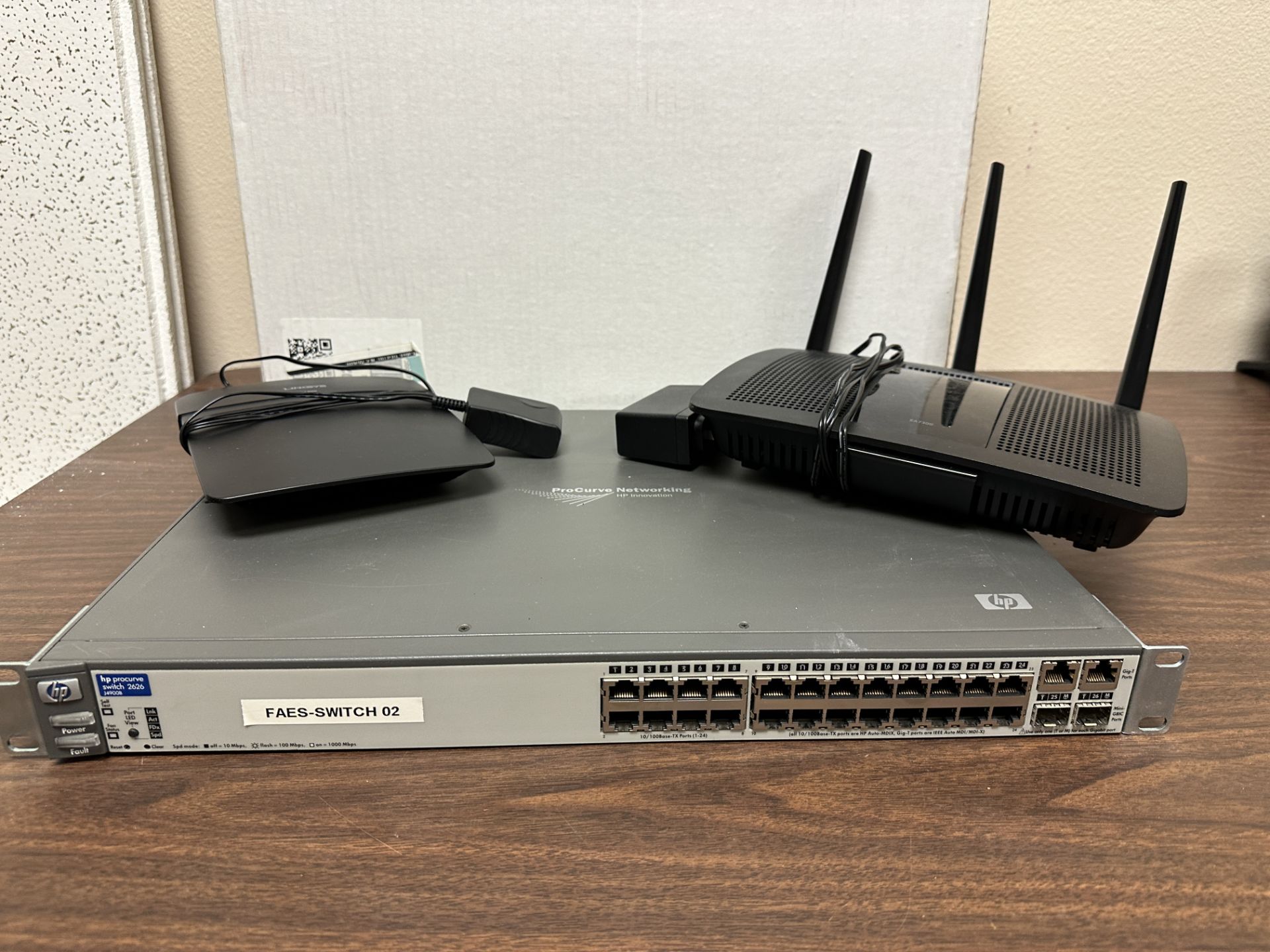 Networking Equipment: HO Procurve Switch, Linksys E1200 and Linksys EA7300, FA3 - Image 2 of 7