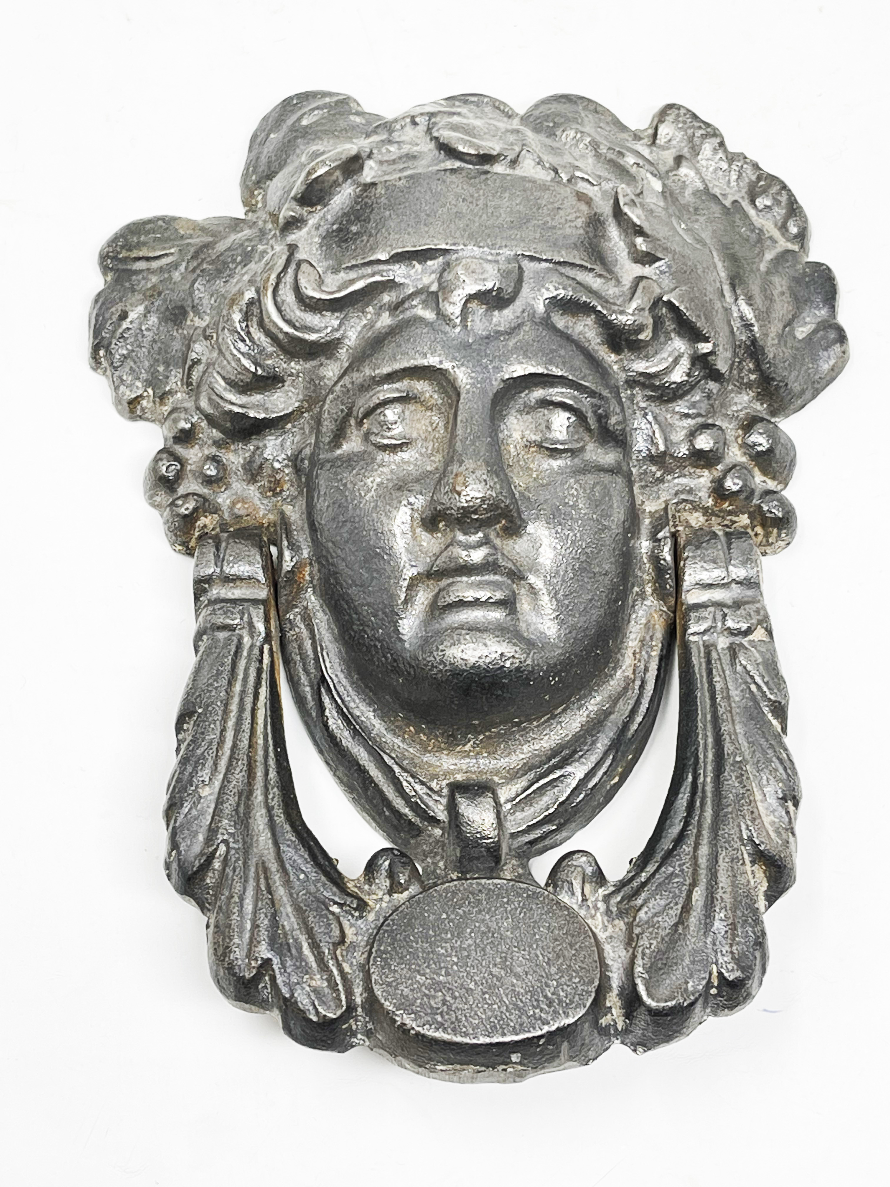 Knocker with head of Dionysus (?). 18.6 x 14.6 x 4.8 cm