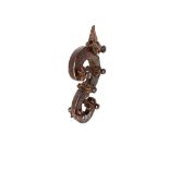 Strong wrought iron door knocker in the shape of an S Section decorated on each side with six