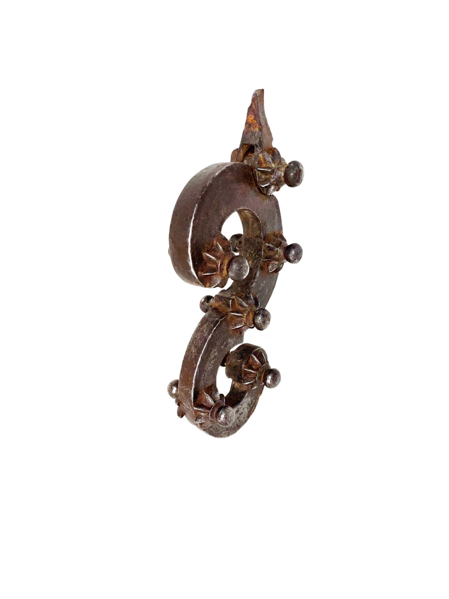 Strong wrought iron door knocker in the shape of an S Section decorated on each side with six