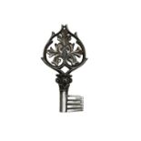 Wrought and chased iron key, cordial ring pierced with foliage and a thistle bud on a Corinthian