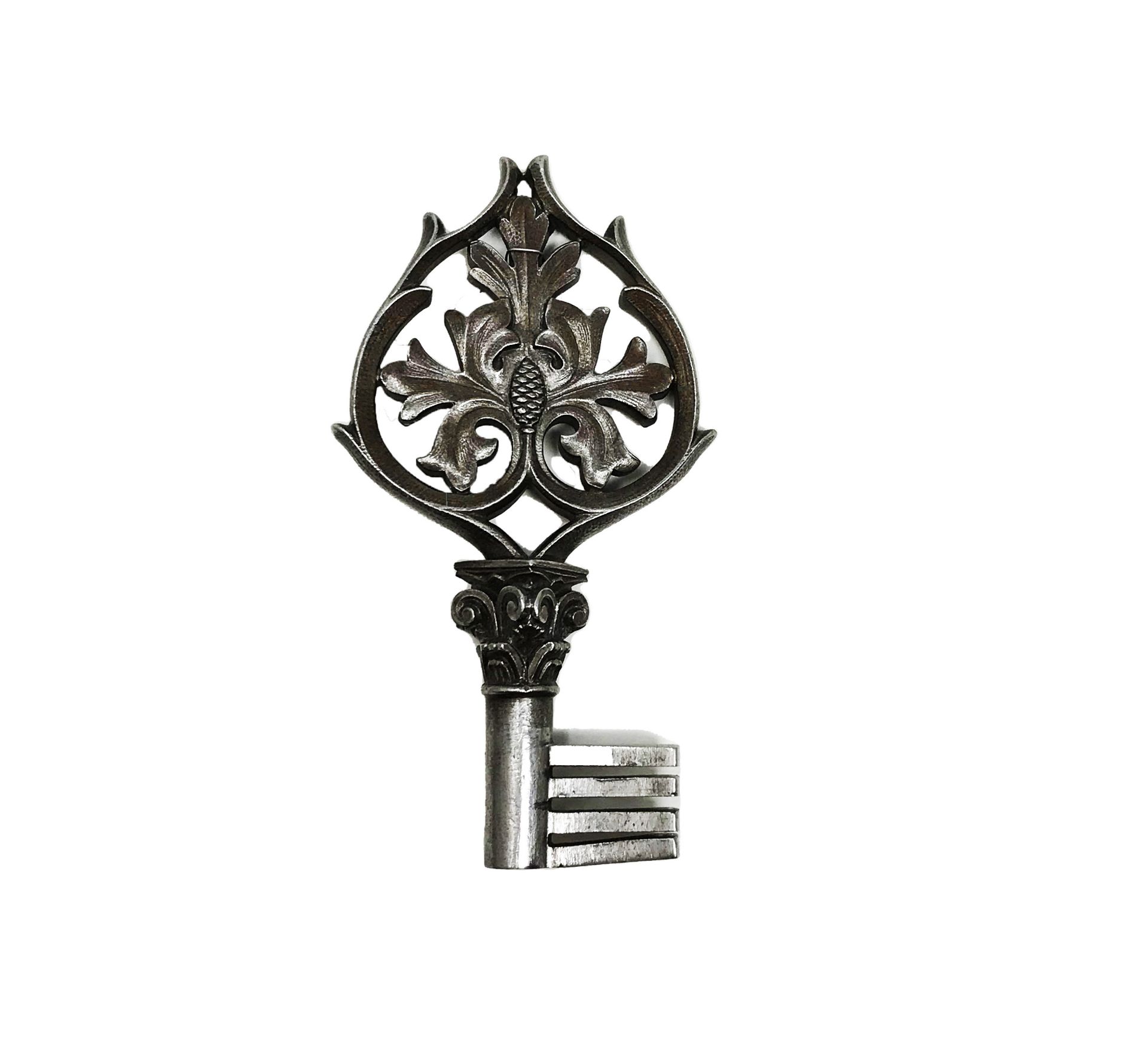 Wrought and chased iron key, cordial ring pierced with foliage and a thistle bud on a Corinthian