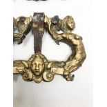 A pair of bronze handles with two mermaids and a mascaron. 9, 11 x 12, 54 cm. Part of the chapter "