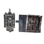 Two locks of the same construction:- one, crowned by a capital and supported by foliage scrolls, two