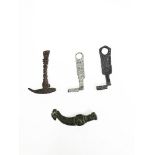 Two iron keys (4.9 and 5.8 cm). A multi-tool - iron punch, hammer and chisel - (7.8 cm). A bronze