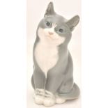 Porcelain figurine "Sitting cat". - Denmark, Royal Copenhagen, 20th cent. - 7x6x14 cm.