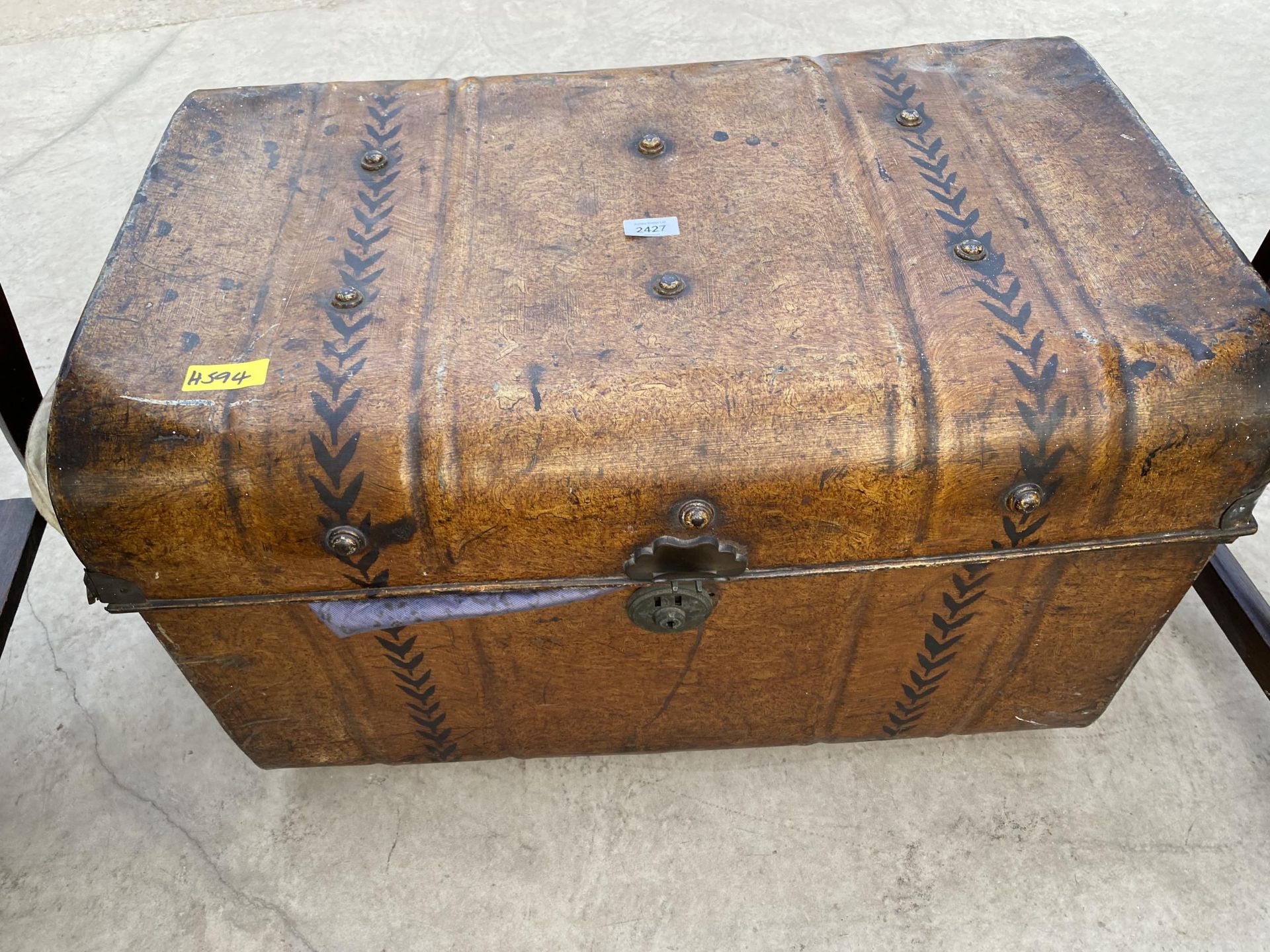 A PAINTED METALWARE TRAVELING TRUNK