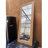 A MODERN PINE FRAMED WALL MIRROR