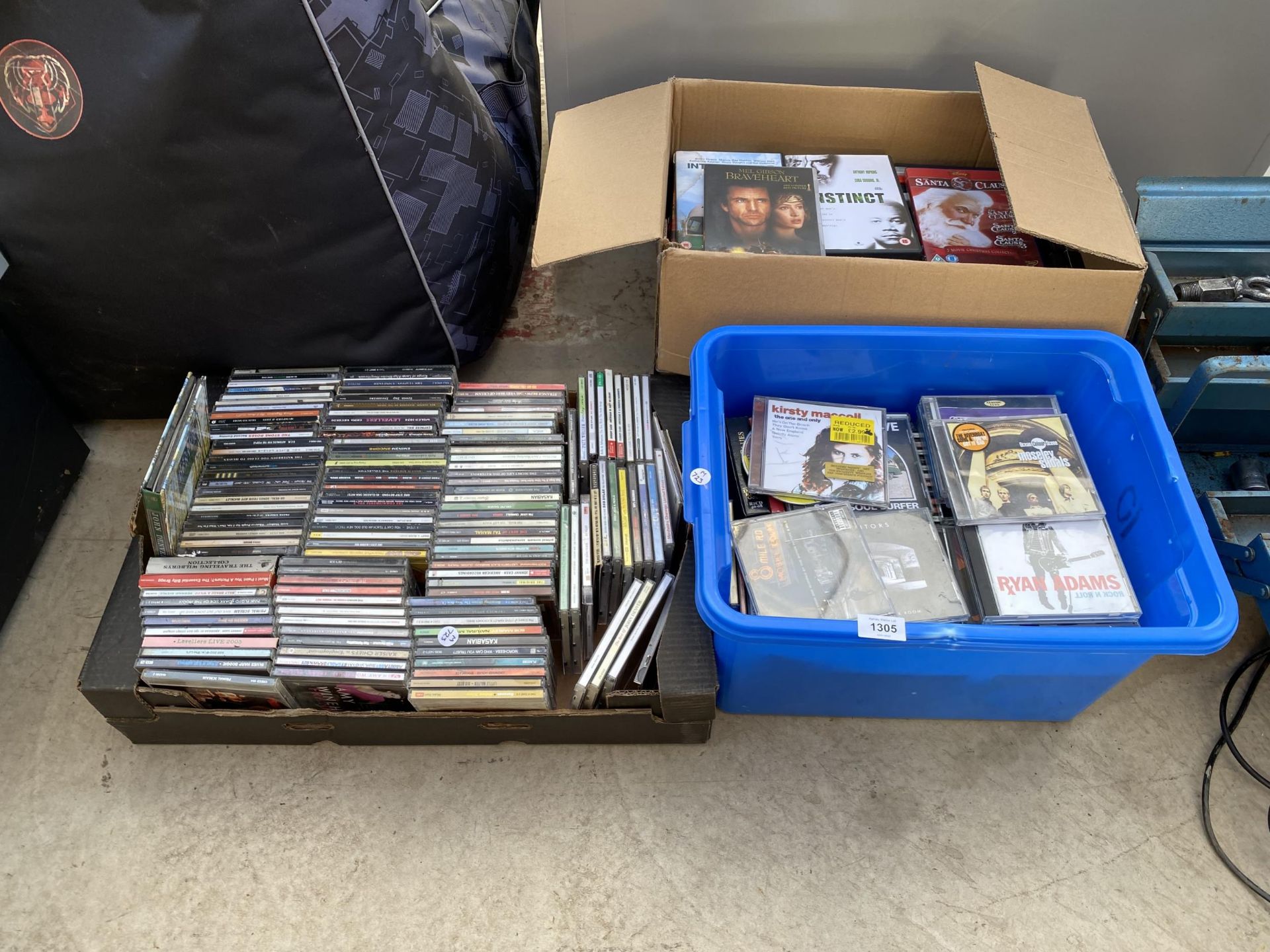 A LARGE QUANTITY OF DVDS AND CDS