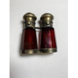 A VINTAGE CRANBERRY GLASS AND METAL DOUBLE PERFUME BOTTLE MODELLED IN THE FORM OF OPERA GLASSES