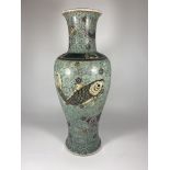 A LARGE MID 19TH CENTURY CHINESE BALUSTER FORM VASE WITH ENAMEL FISH ON A GEOMETRIC CIRCLES