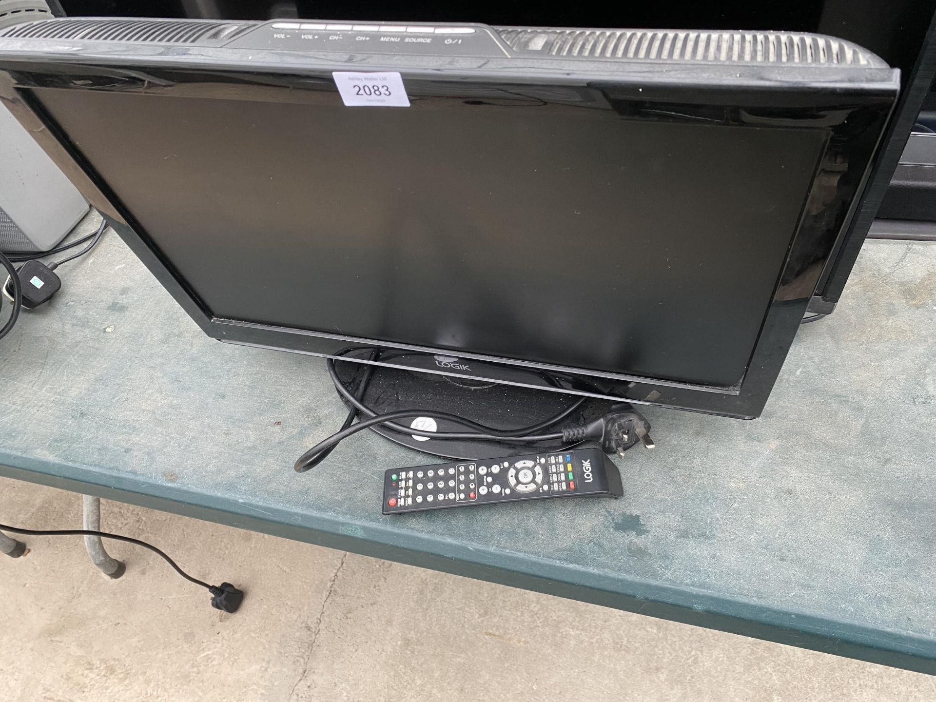 A 21" LOGIK TELEVISION WITH REMOTE CONTROL