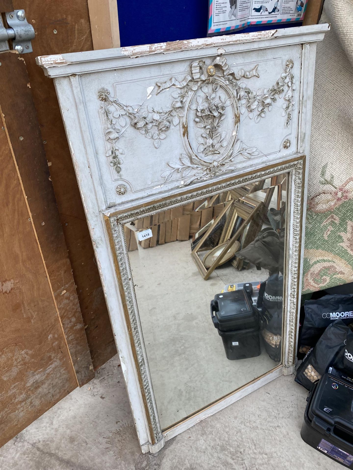 A VINTAGE WOODEN FRAMED BEVELED EDGE WALL MIRROR