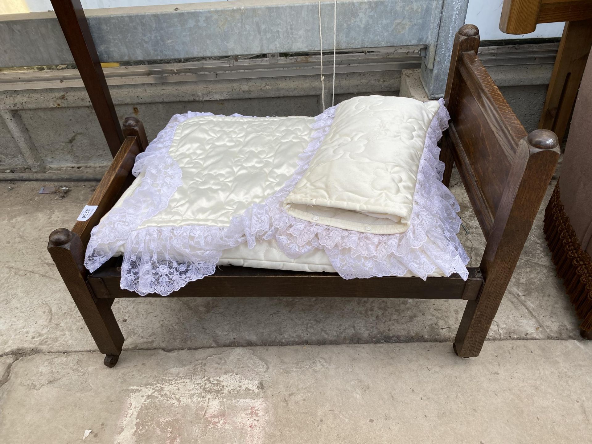 AN OAK DOLLS SINGLE BED