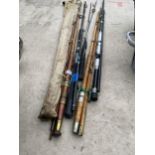 AN ASSORTMENT OF VINTAGE SPLIT CANE FISHING RODS AND MODERN CARBON FIBRE RODS