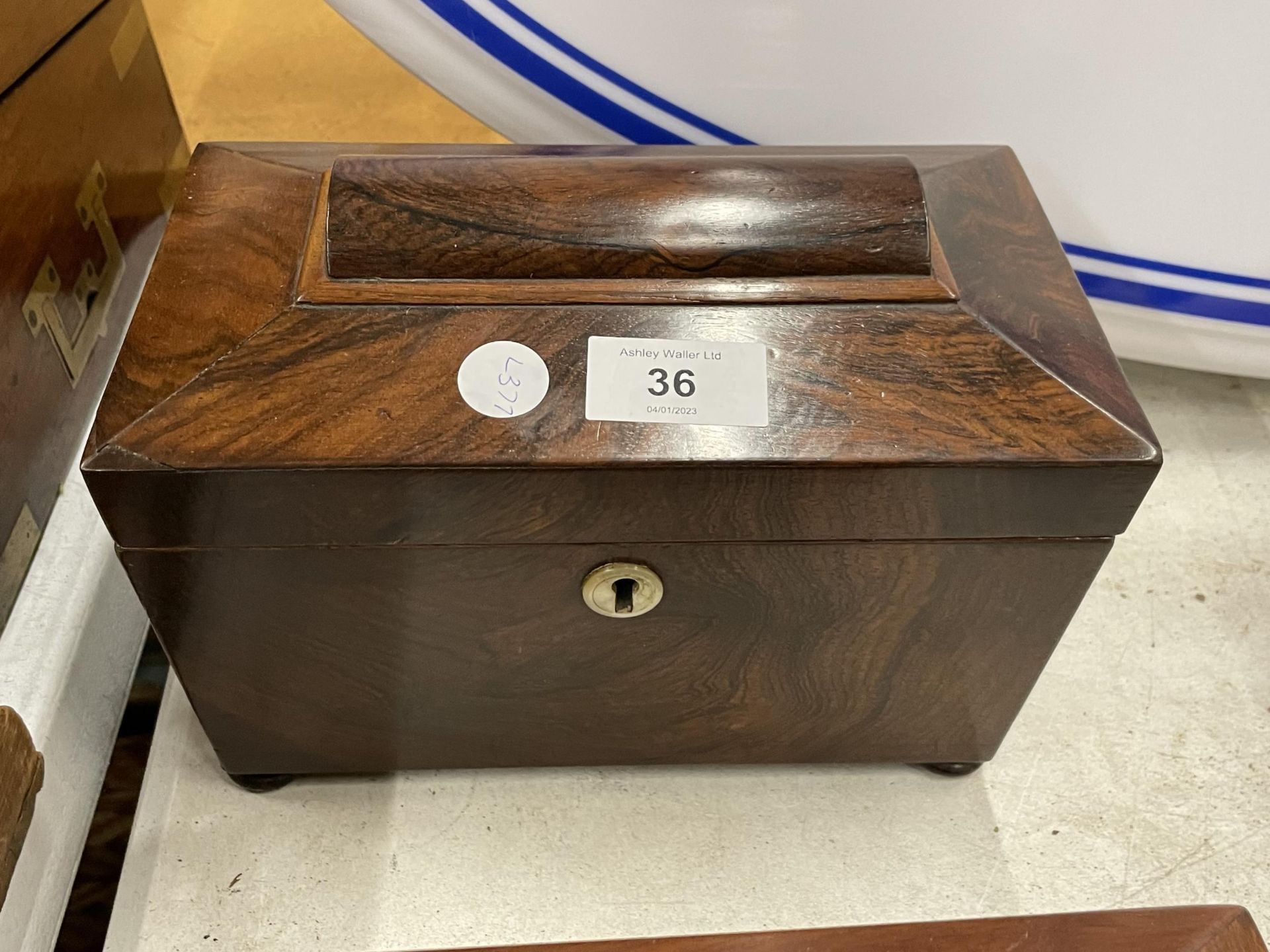 A 19TH CENTURY MAHOGANY TEA CADDY WITH TWO INNER LIDDED SECTIONS