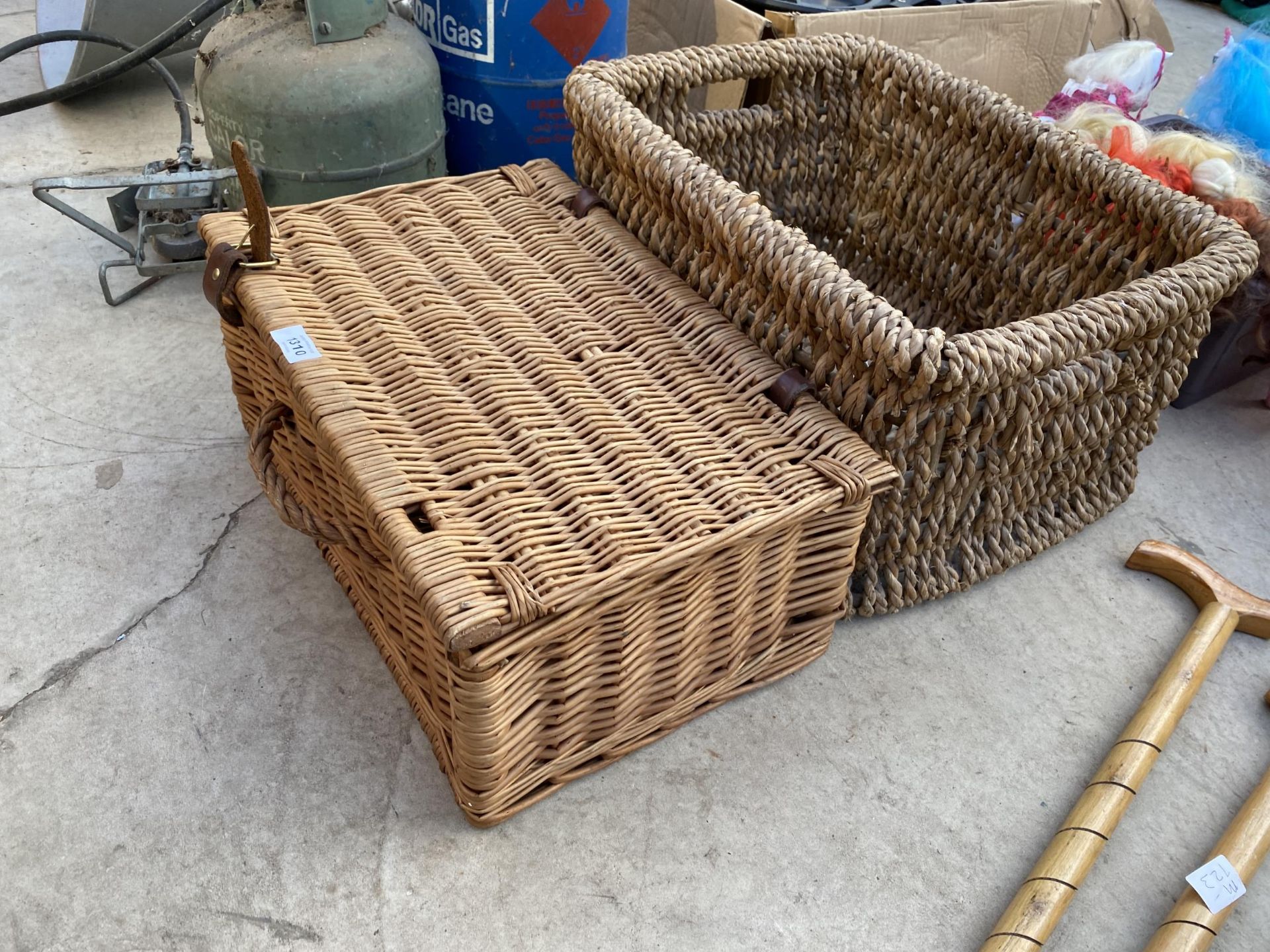 A WICKER PICNIC BASKET AND A FURTHER WICKER EFFECT LOG BASKET