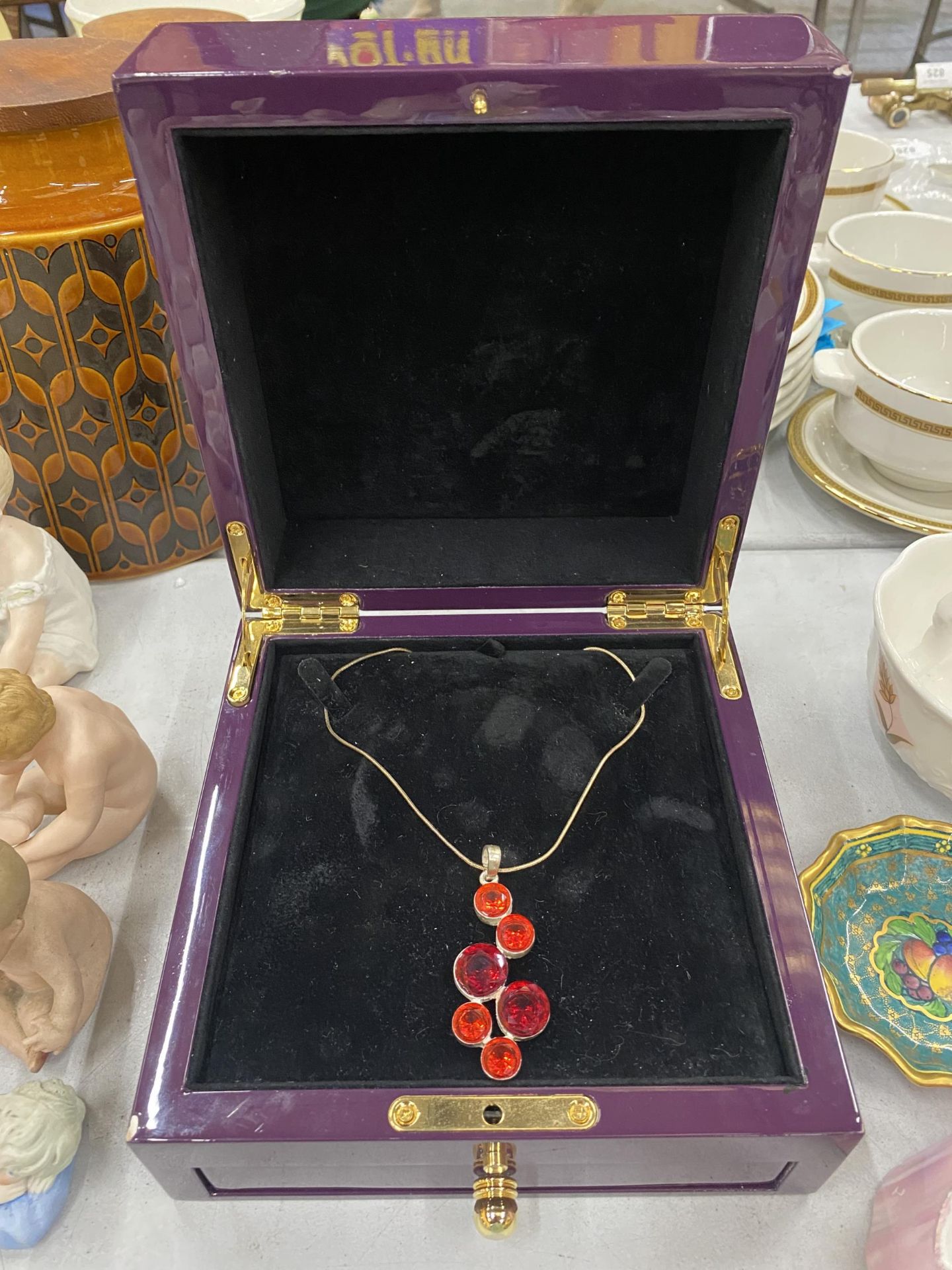 A NECKLACE WITH A LARGE 'CHERRY' DESIGN PENDANT IN PRESENTATION BOX