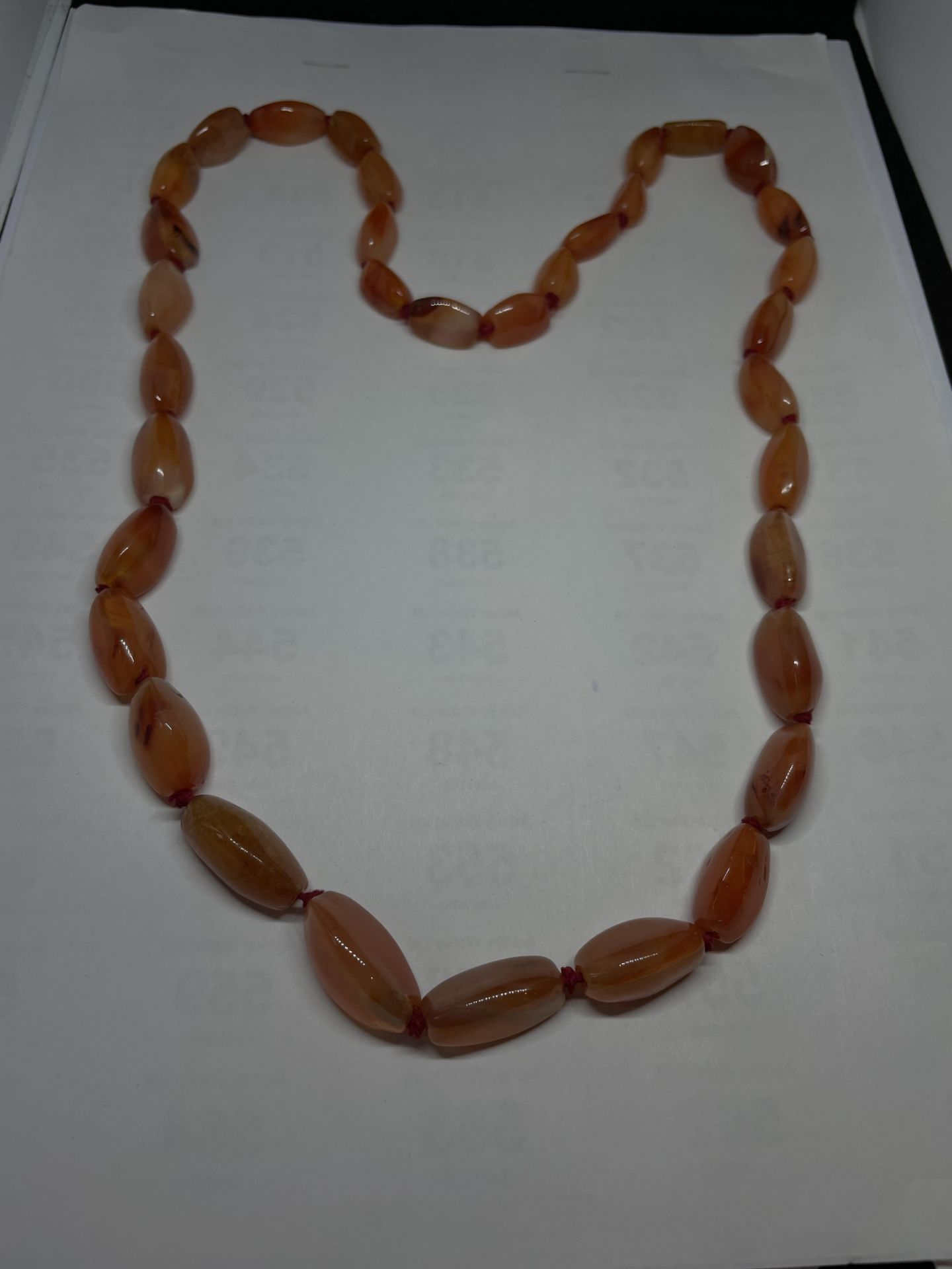 AN AMBER STYLE CARNELIAN CRYSTAL NECKLACE LENGTH 72CM