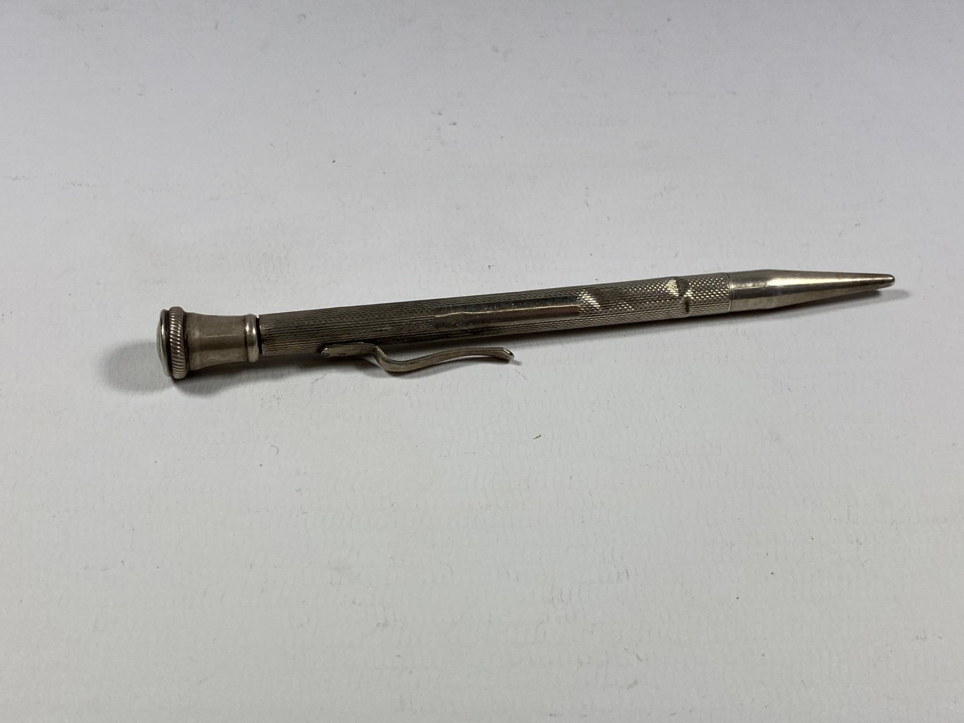 A SILVER PROPELLING PENCIL