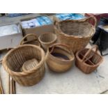 AN ASSORTMENT OF WICKER BASKETS TO INCLUDE A LARGE LOG BASKET, A SMALLER LOG BASKET AND THREE