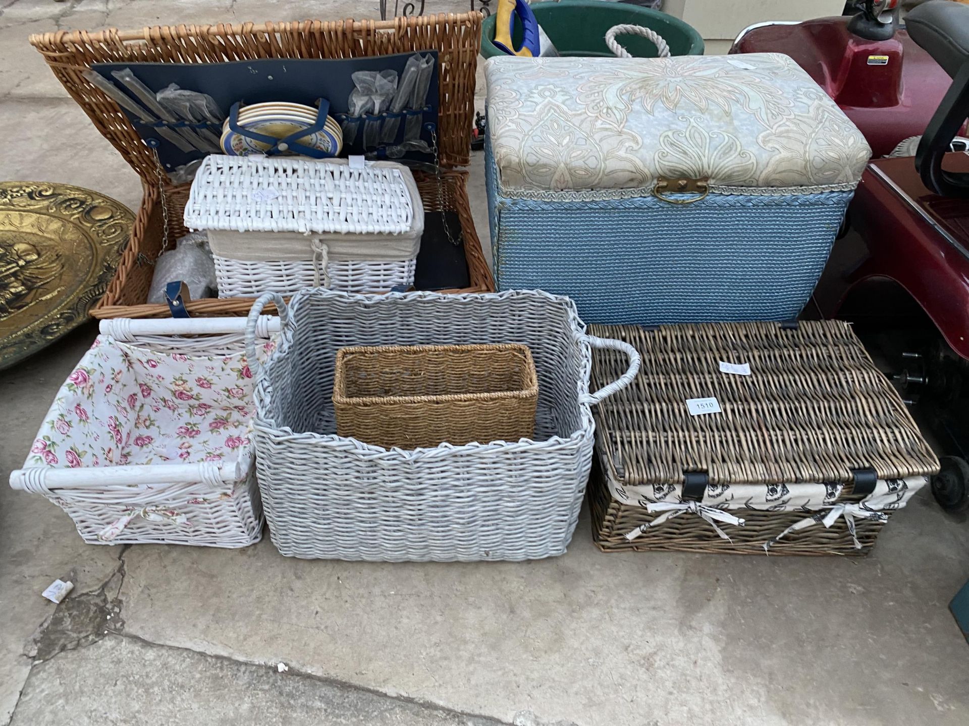 AN ASSORTMENT OF WICKER BASKETS AND A LLYOD LOOM STYLE OTTOMAN