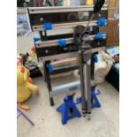 A MACALLISTER FOLDING WORK BENCH, A TRIPOD STAND AND TWO AXEL STANDS ETC