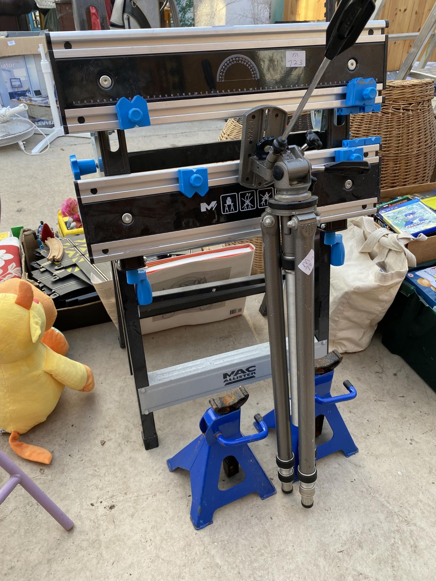 A MACALLISTER FOLDING WORK BENCH, A TRIPOD STAND AND TWO AXEL STANDS ETC