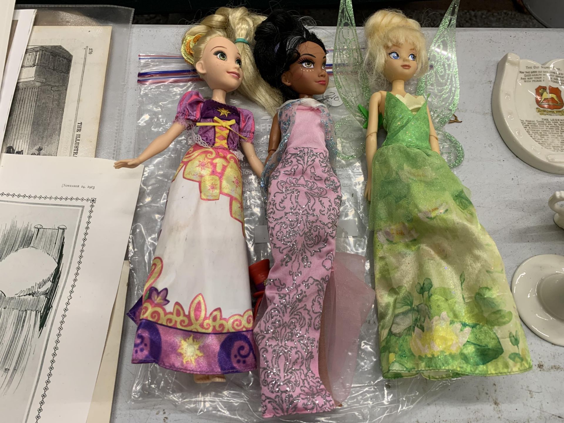 THREE DISNEY DOLLS IN COSTUMES