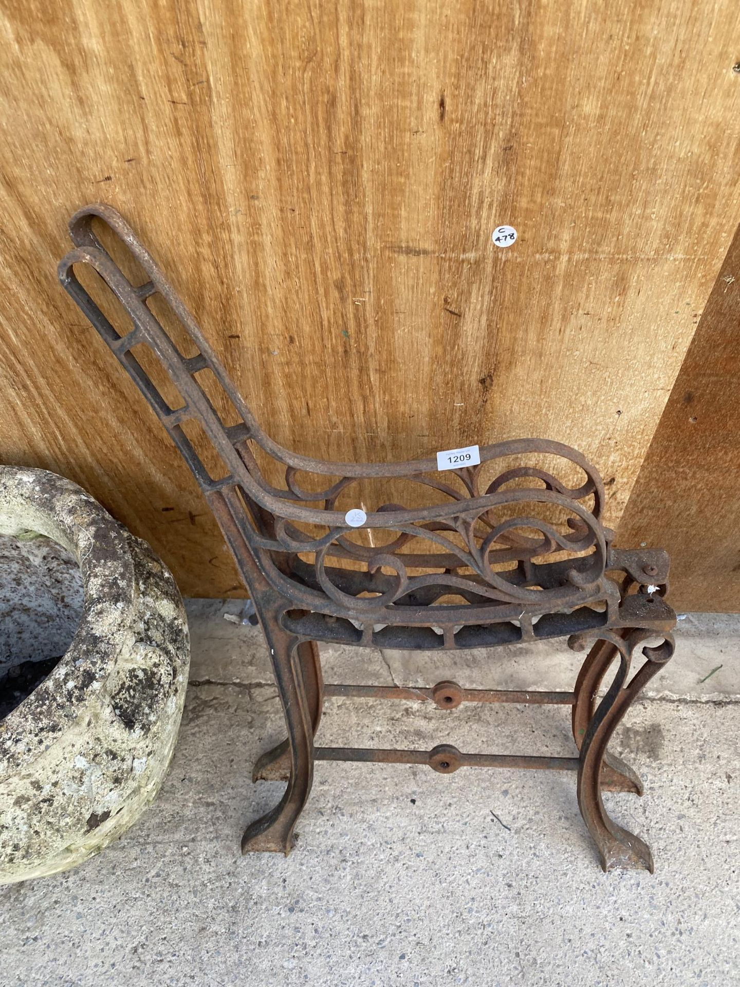 A PAIR OF SMALL CAST IRON BENCH ENDS