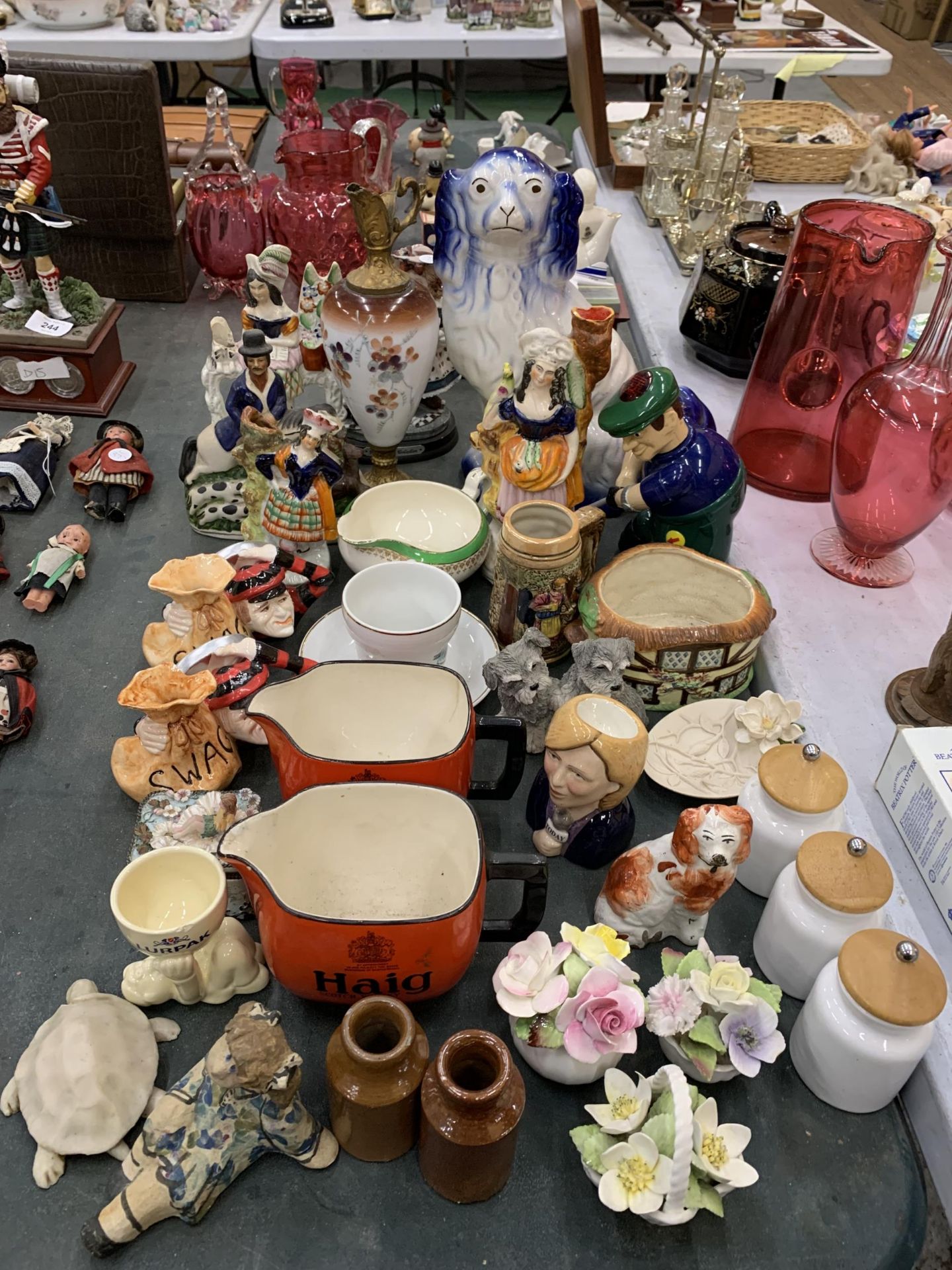 A LARGE QUANTITY OF CERAMIC ITEMS TO INCLUDE HAIG WHISKY JUGS, STAFFORDSHIRE STYLE FIGURES,