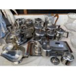 A LARGE ASSORTMENT OF STAINLESS STEEL ITEMS TO INCLUDE TEAPOTS, JUGS AND A toast rack etc