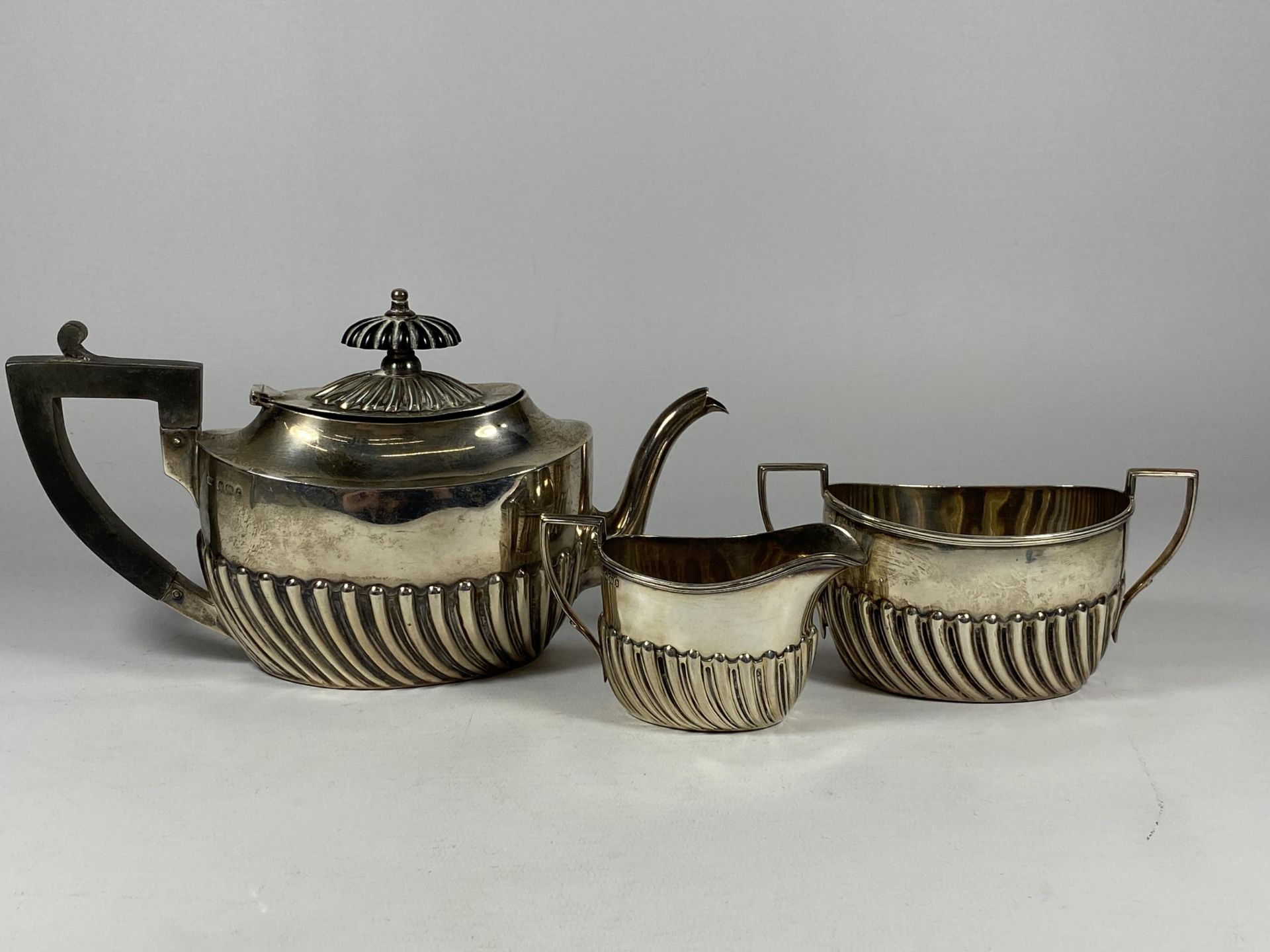 A VICTORIAN SILVER BACHELORS THREE PIECE TEA SET, HALLMARKS FOR SHEFFIELD, 1895, MAKERS HARRISON