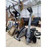 A ROWING MACHINE AND AN EXERCISE BIKE