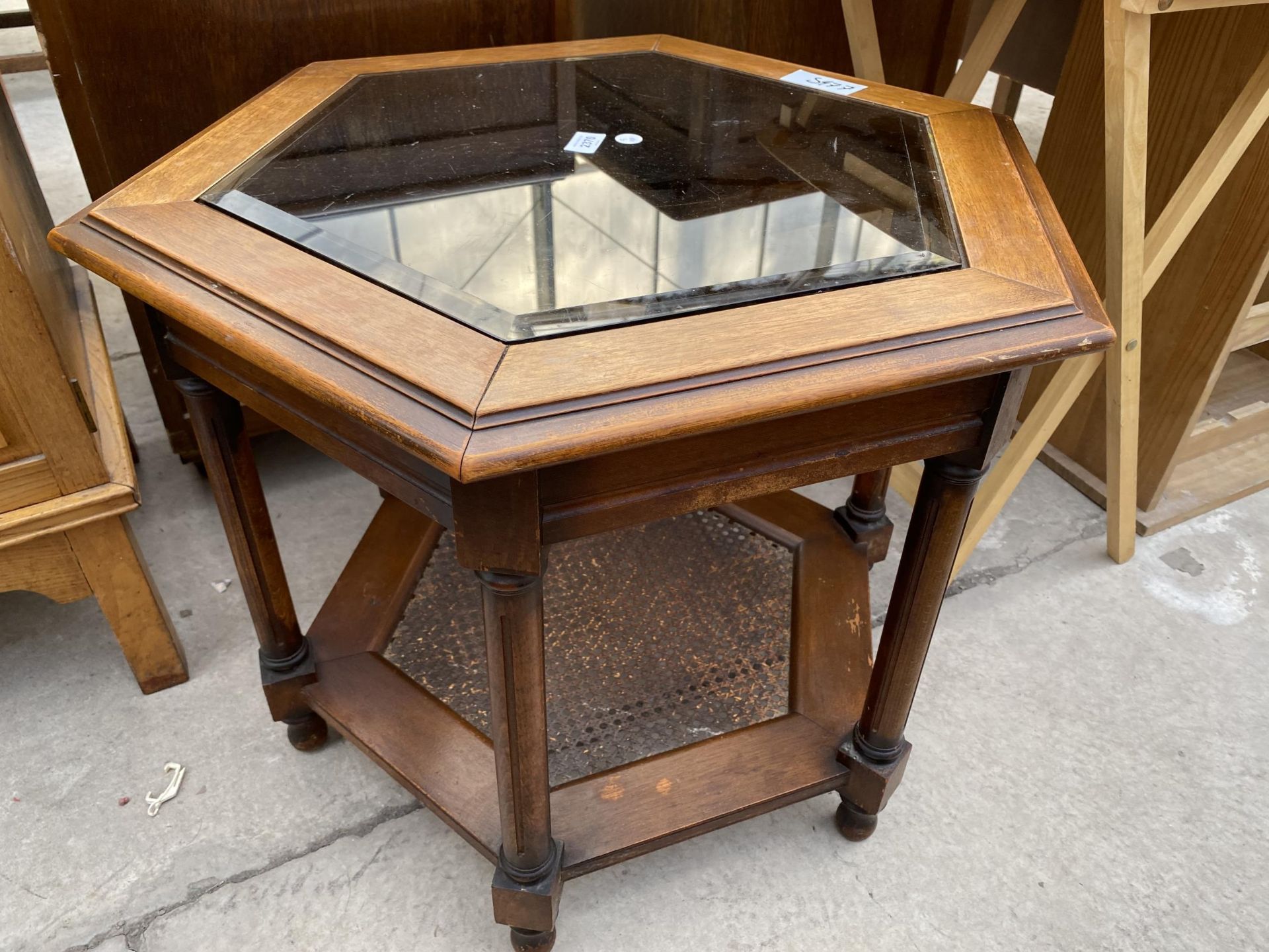 A MODERN HEXAGONAL COFFEE TABLE WITH GLASS INSET TOP AND SPLIT CANE BOTTOM TIER, 28" ACROSS MAX