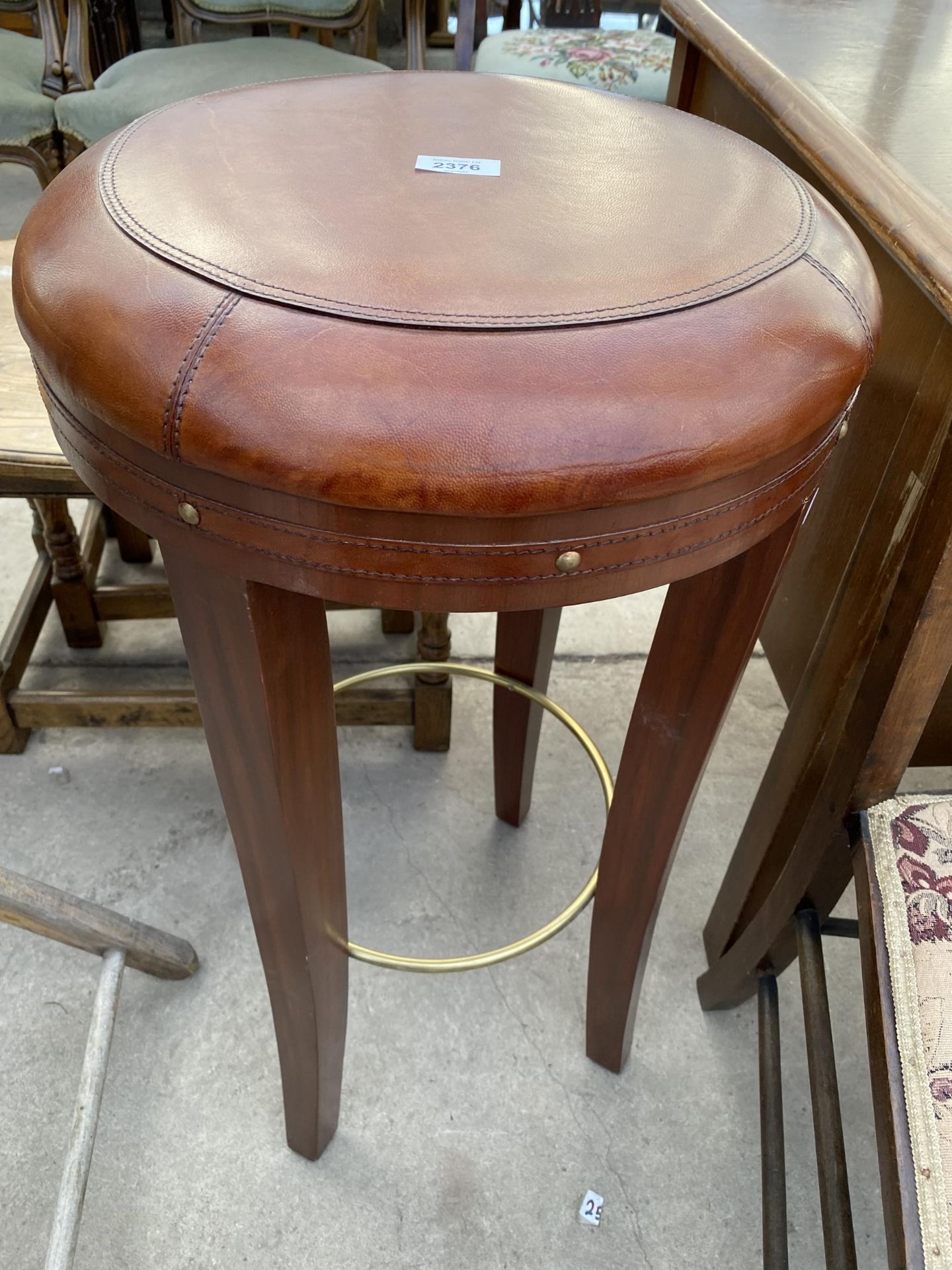 A 'NICKY CORNELL' BAR STOOL WITH LEATHER TOP