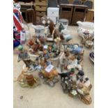 AN ASSORTMENT OF ITEMS TO INCLUDE BIRD FIGURES, TREEN ANIMALS AND A MILK JUG ETC
