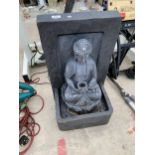 A PLASTIC BUDDAH WATER FEATURE