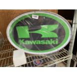 AN ILLUMINATED 'KAWASAKI' SIGN WITH LEAD AND CABLE