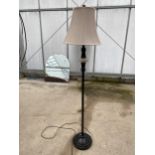 A MODERN BLACK METAL STANDARD LAMP