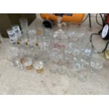 A LARGE QUANTITY OF GLASS WARE TO INCLUDE TUMBLERS AND SHERRY GLASSES ETC