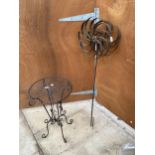 A SMALL DECORATIVE METAL SIDE TABLE AND A METAL WIND SPINNER