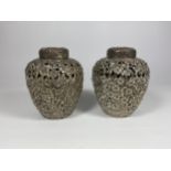 A PAIR OF UNUSUAL WHITE METAL, POSSIBLY CHINESE, LIDDED TEA CADDIES, HEIGHT 11CM