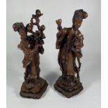 A PAIR OF ORIENTAL RESIN ROOTWOOD STYLE GEISHA FIGURES, HEIGHT 27CM