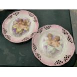 TWO DECORATIVE CABINET PLATES WITH CHERUB DESIGN AND PIERCED EDGES DIAMETER 22CM