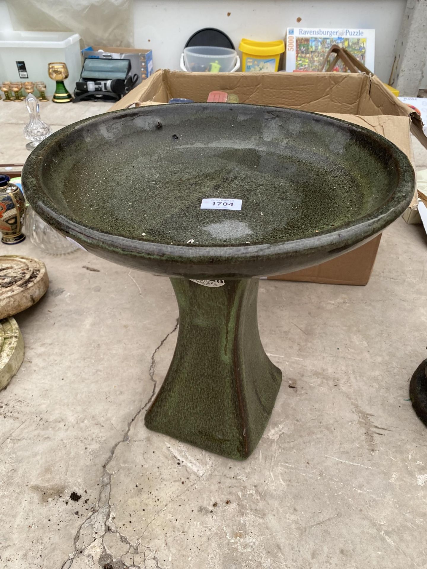 A SMALL GLAZED CERAMIC BIRD BATH