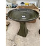 A SMALL GLAZED CERAMIC BIRD BATH