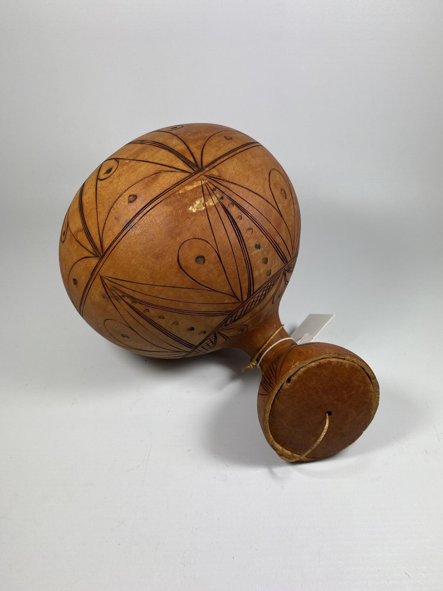 A VINTAGE TRIBAL WOODEN POPPY SEED GOURD