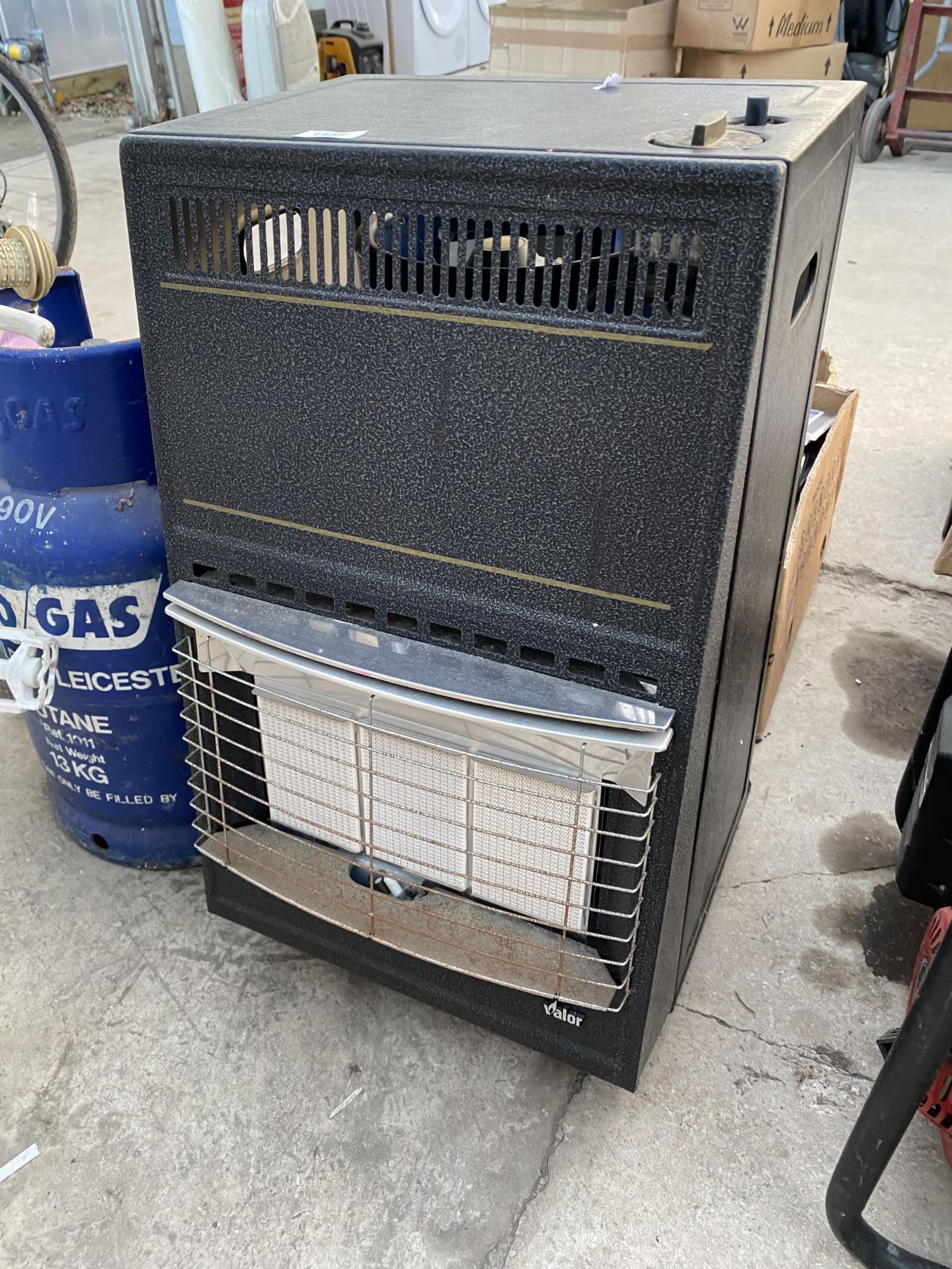 A VALOR GAS HEATER AND TWO GAS BOTTLES