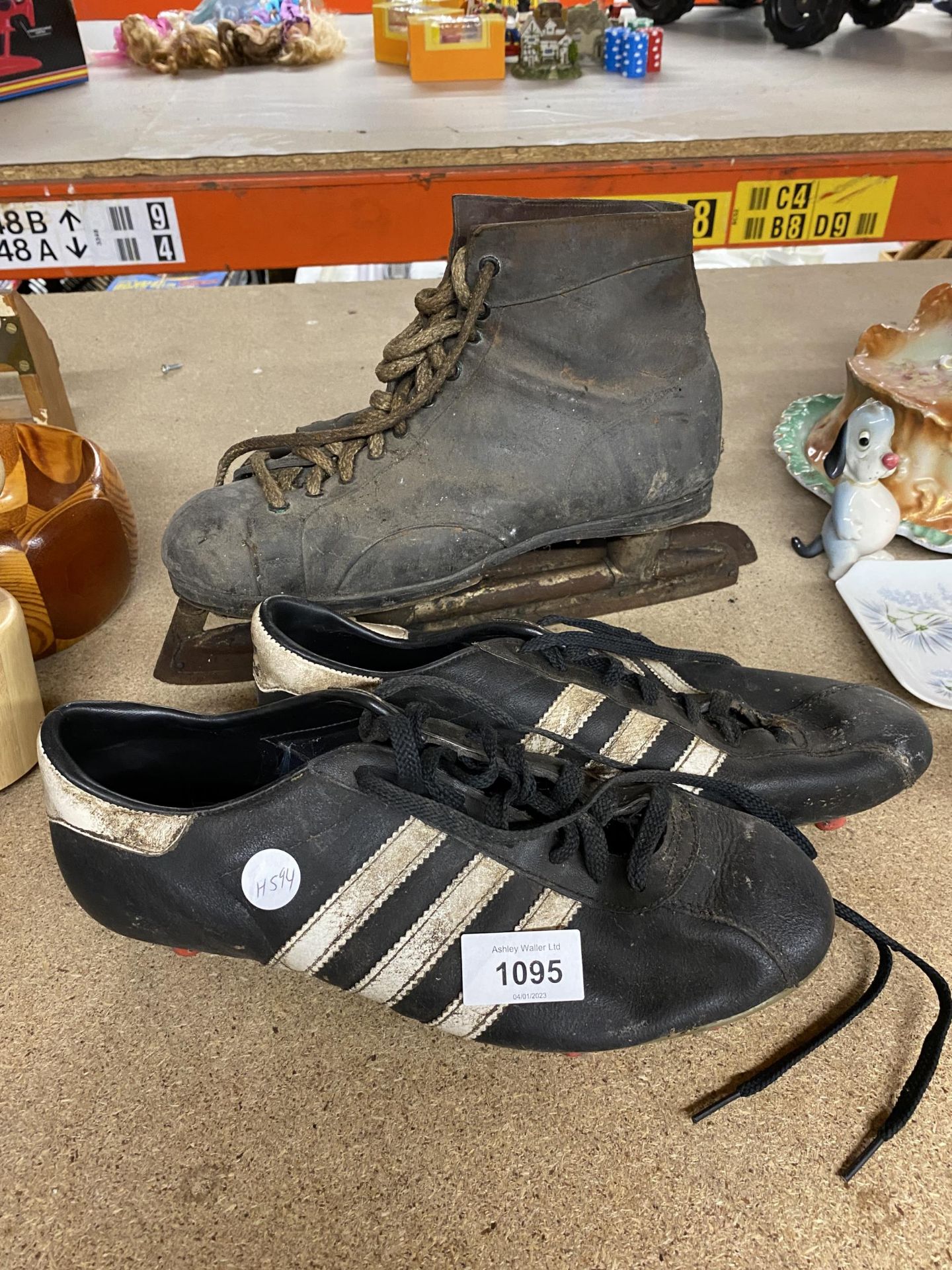 A VINTAGE PAIR OF ADIDAS FOOTBALL BOOTS AND ICE SKATES